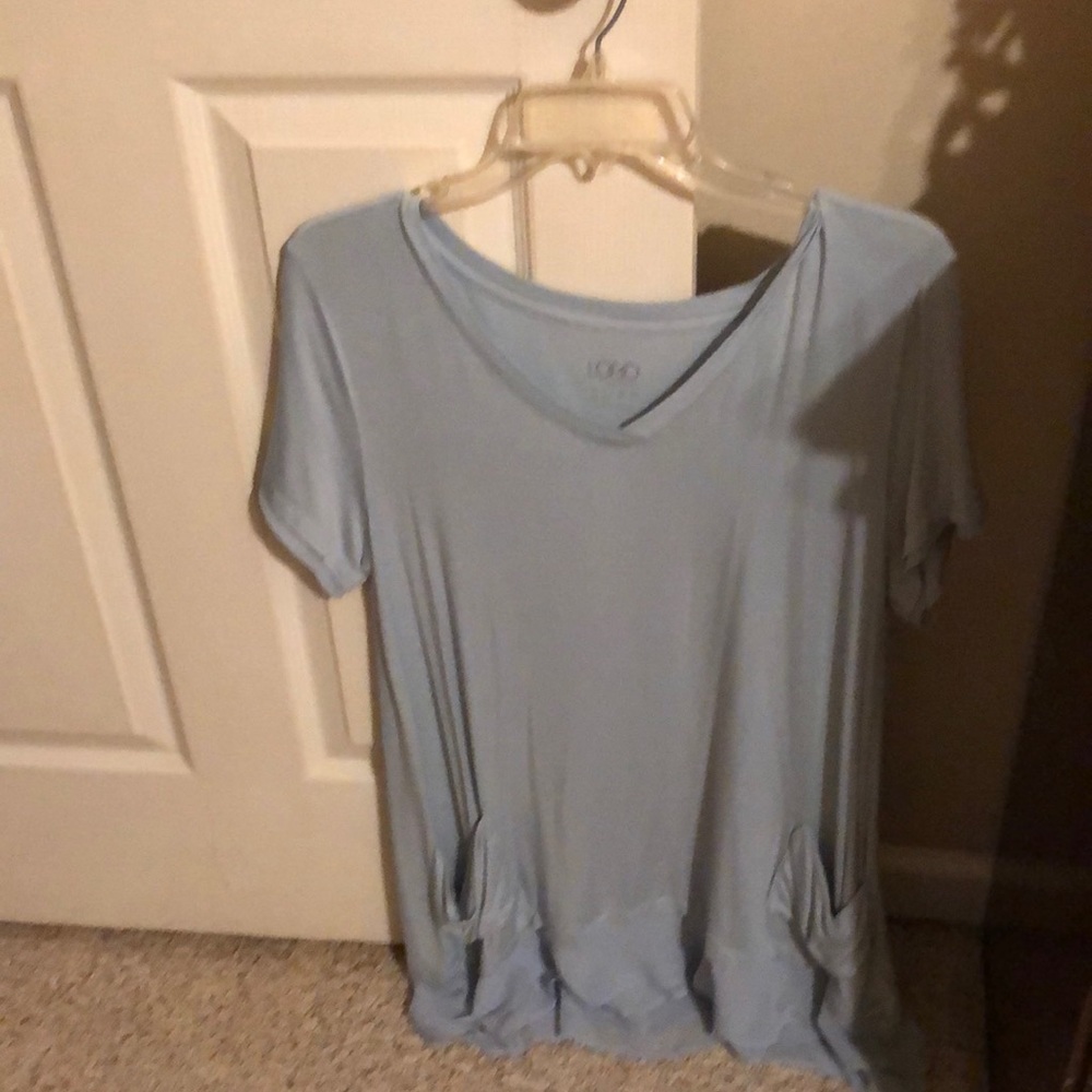 Logo brand long top with ruffles and pockets. Size L, excellent condition.